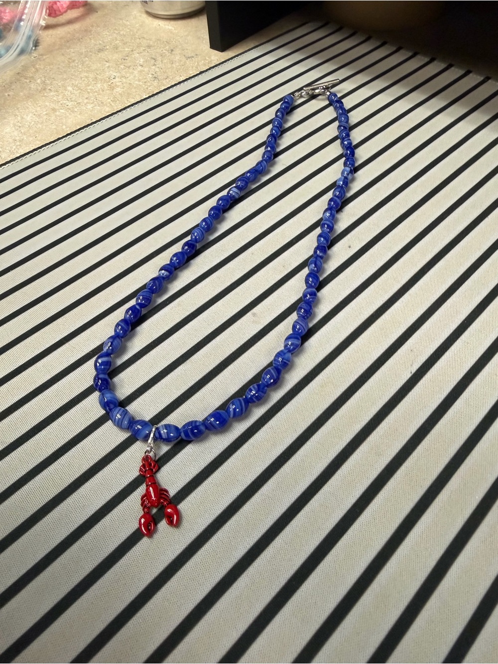 Blue Beaded Necklace with Red Lobster Charm - Chic Coastal Accent